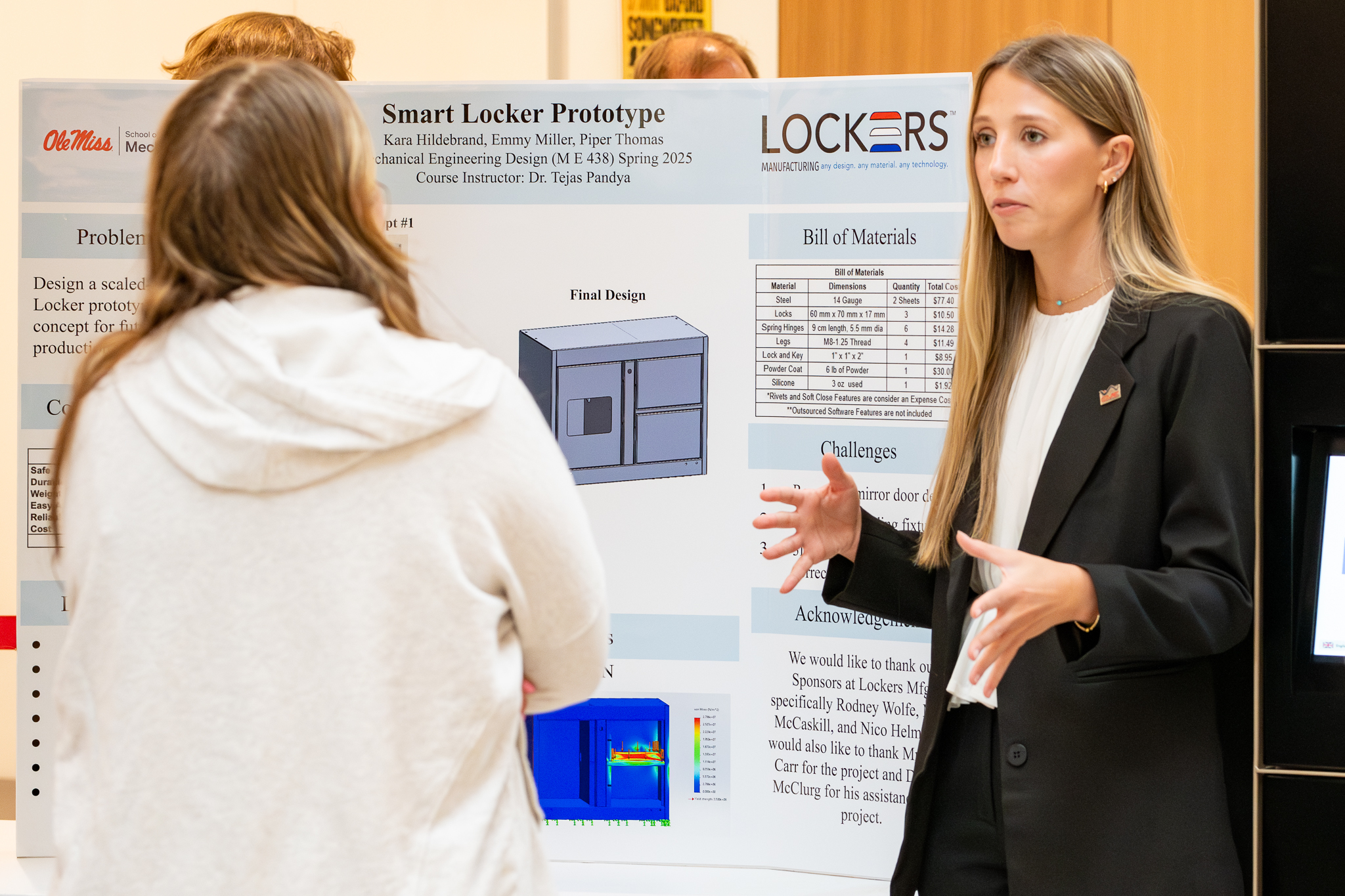 Student presenting research poster