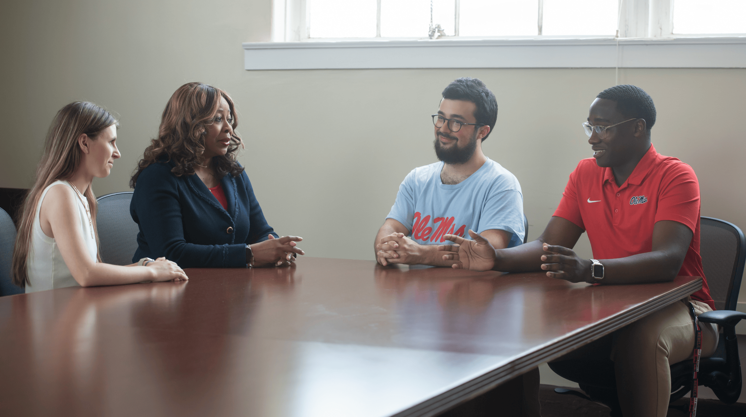 Dean speaking with students