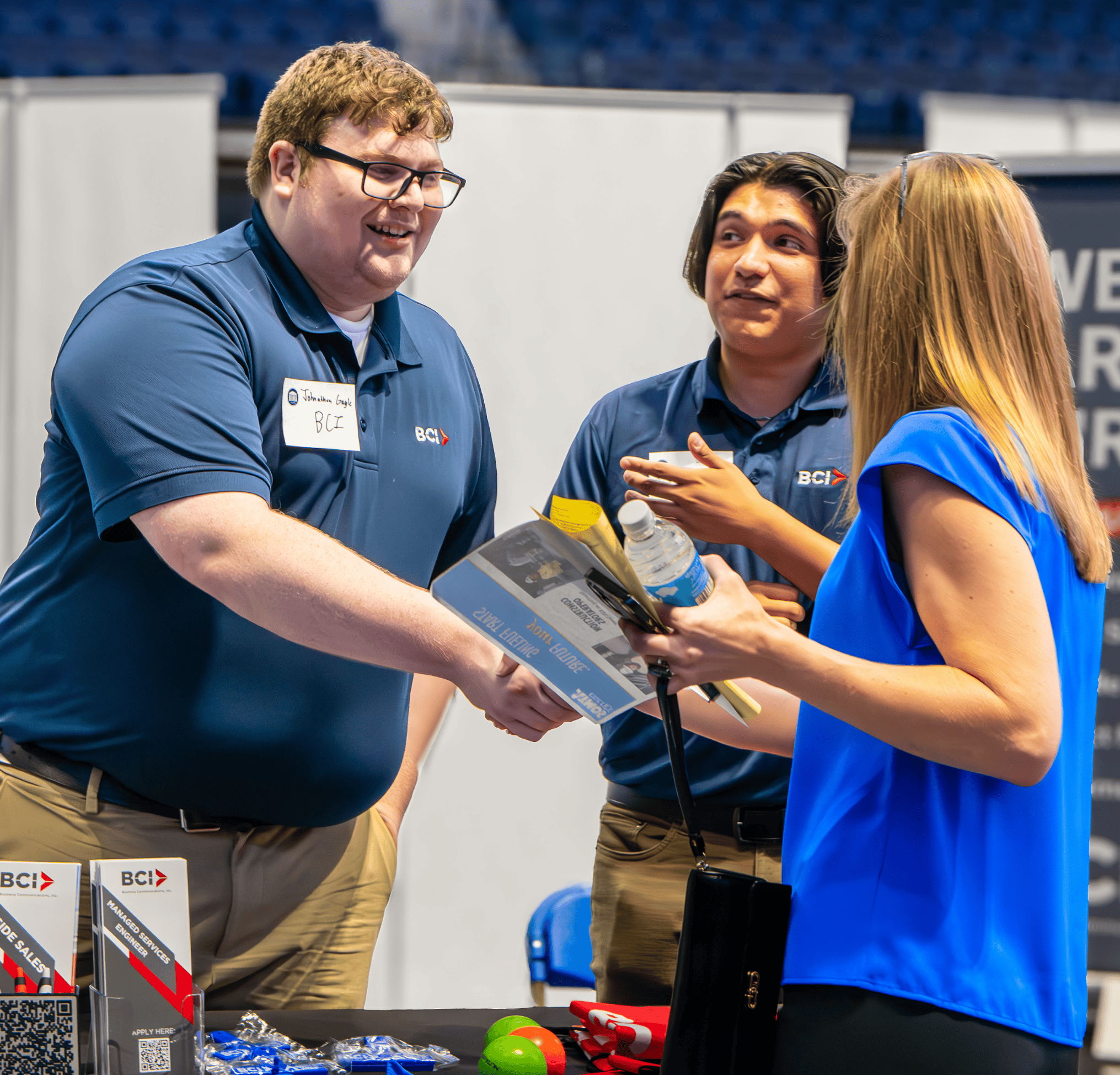 Man and woman shaking hands at career fair