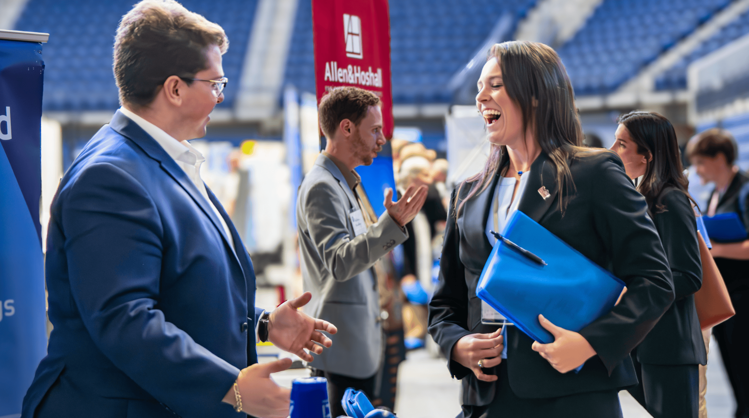 Male and female discussing at a career fair