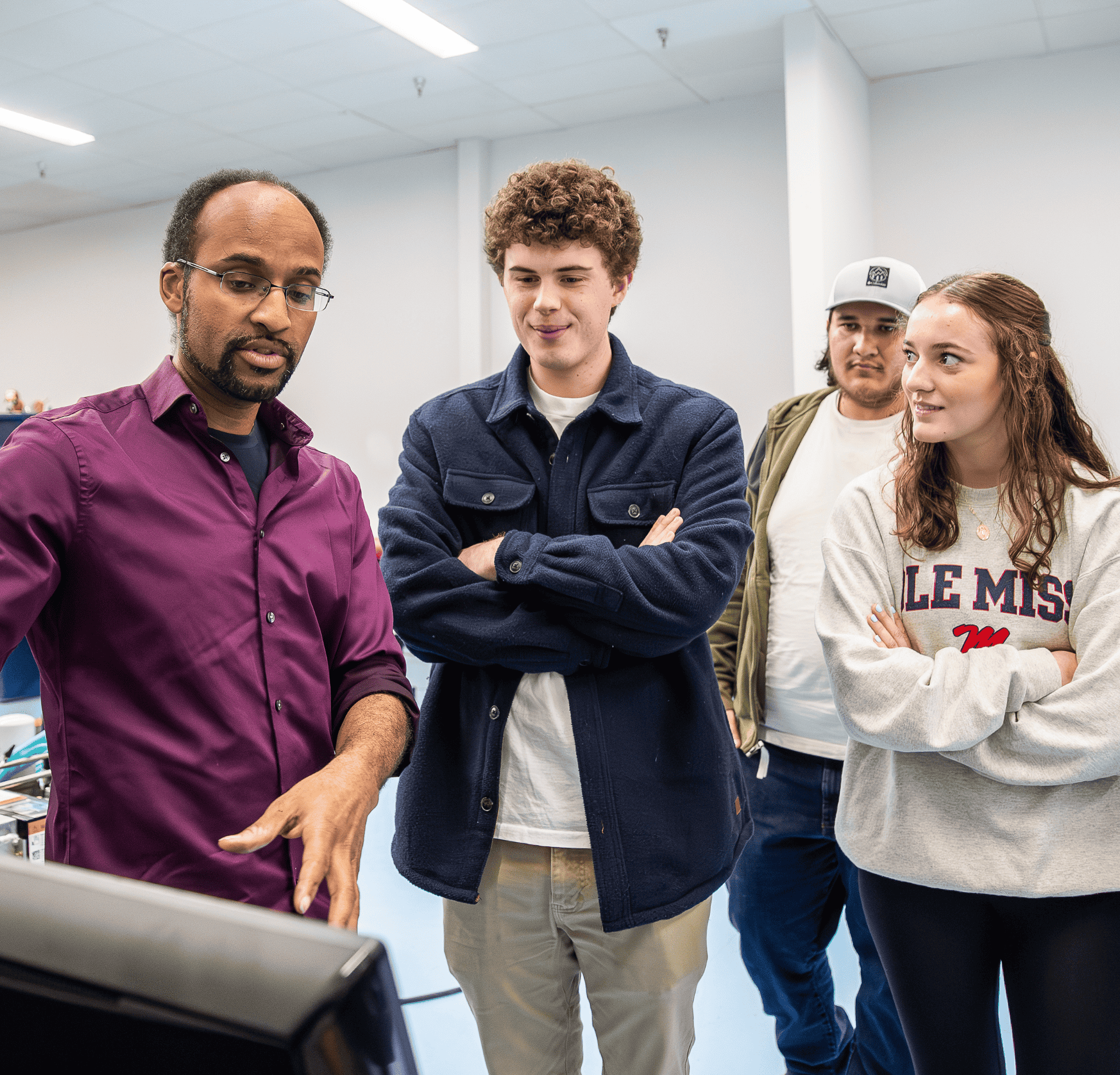 Students learning from professor
