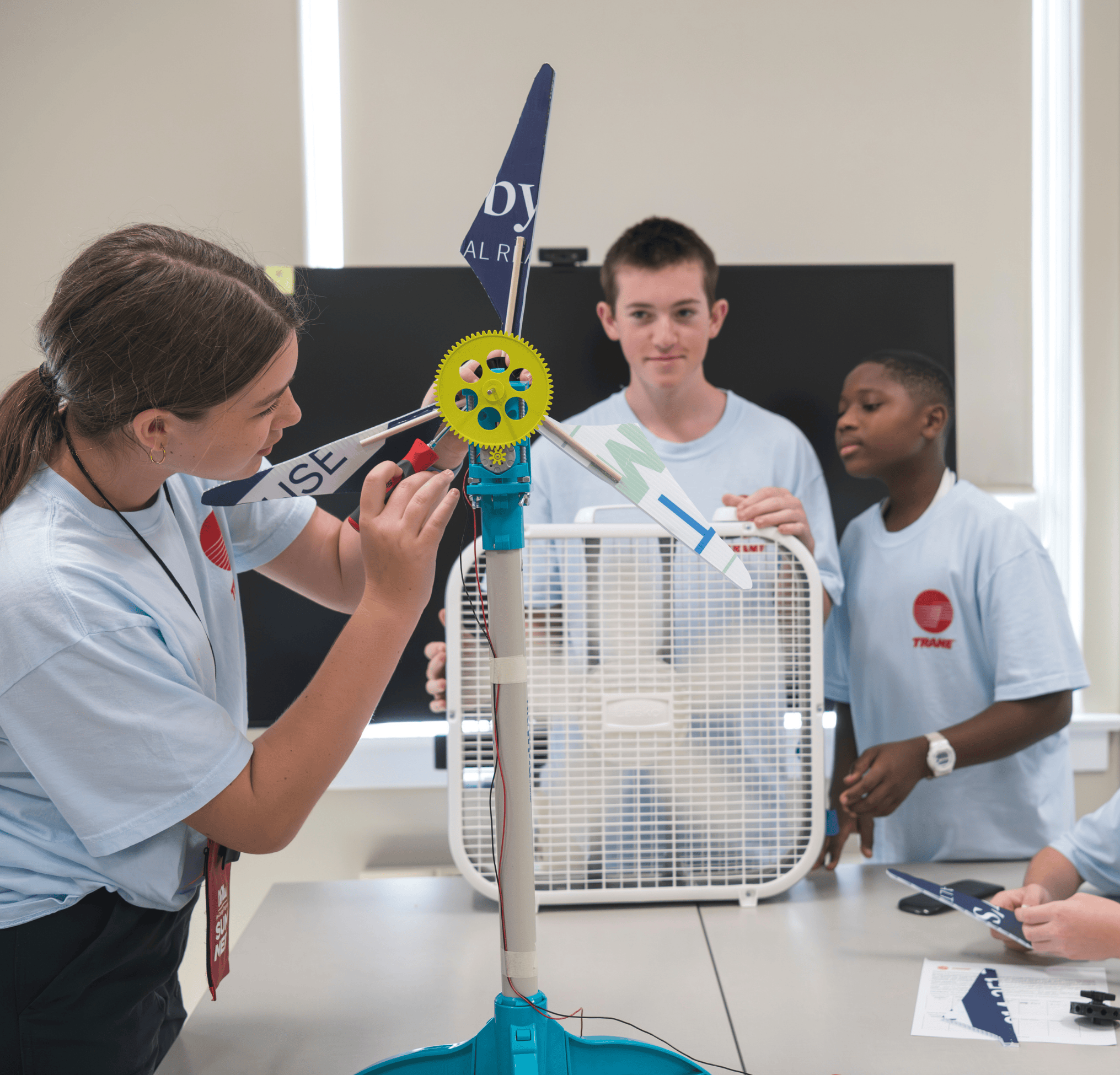 Young students working on engineering experiment