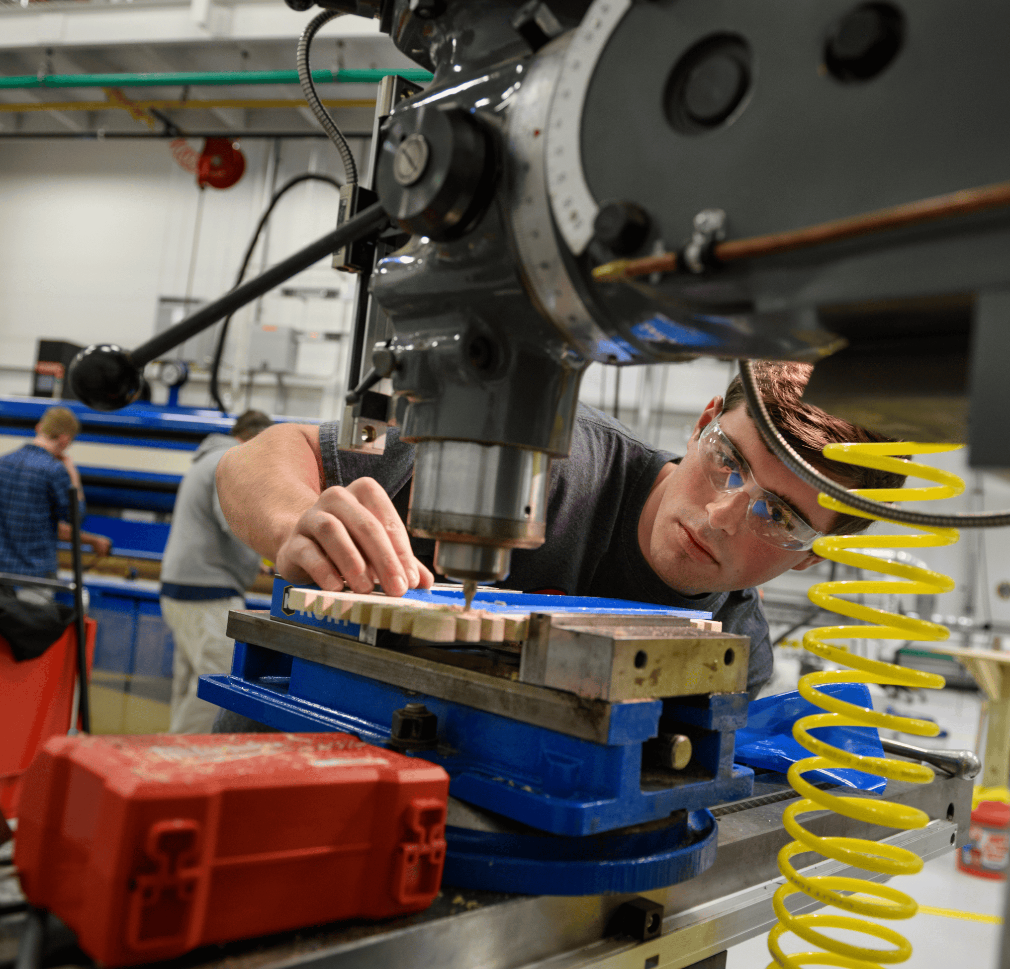 Student working on engineering equipment