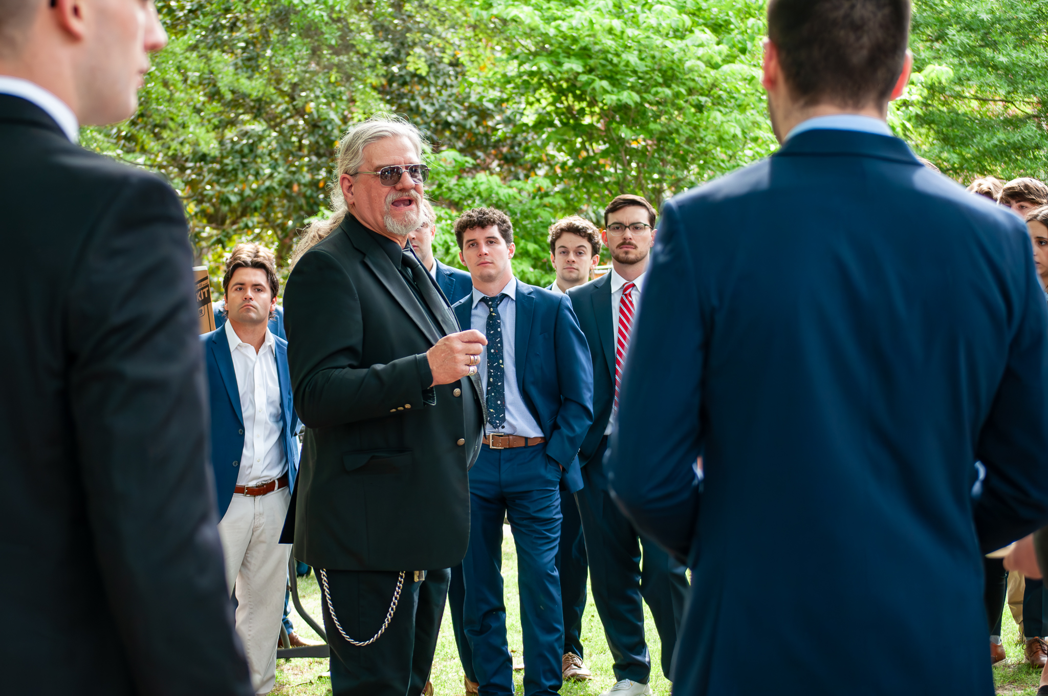 Lecturer speaking with students before event