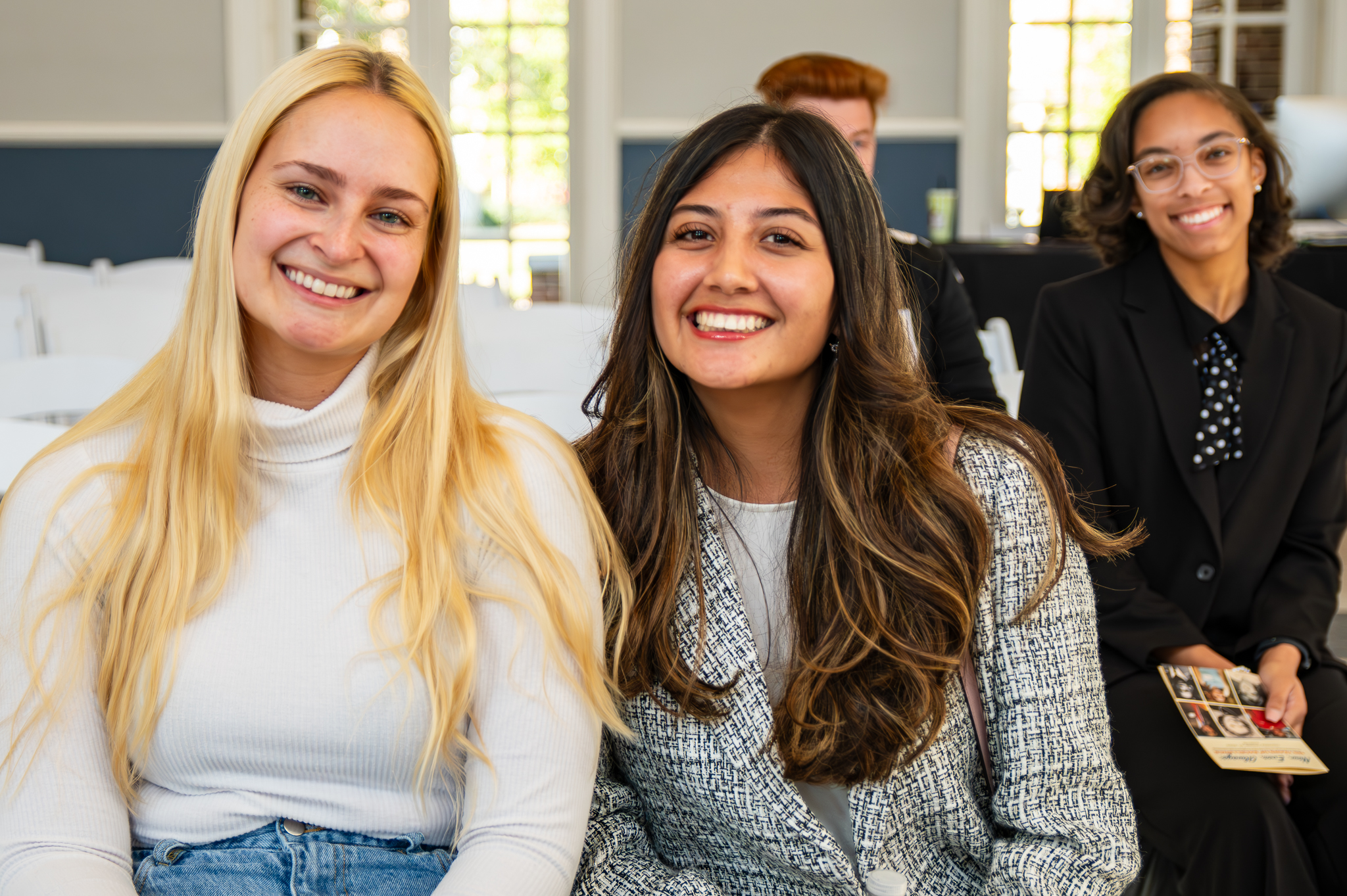 Three engineering students smiling