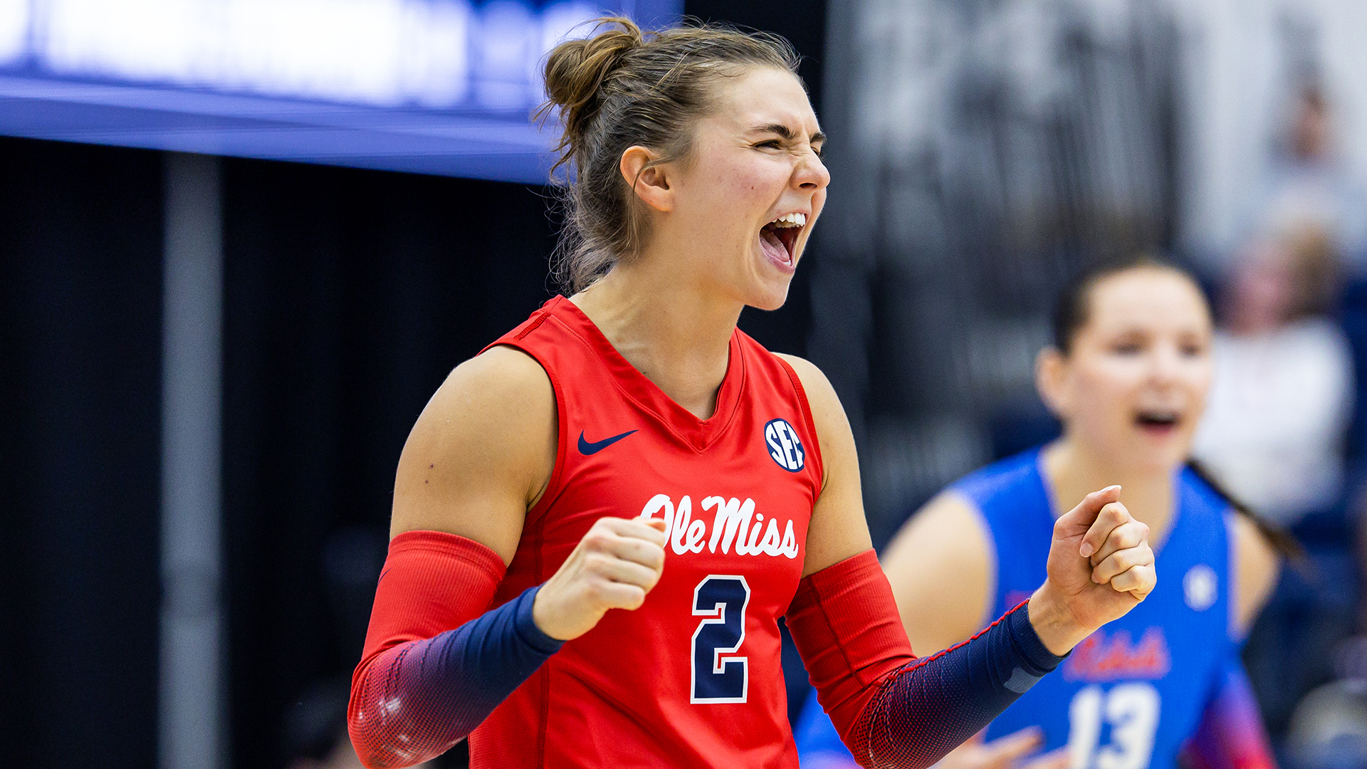 Ole Miss Volleyball student-athlete Cammy Niesen, wearing a red No. 2 jersey, celebrates during a game.