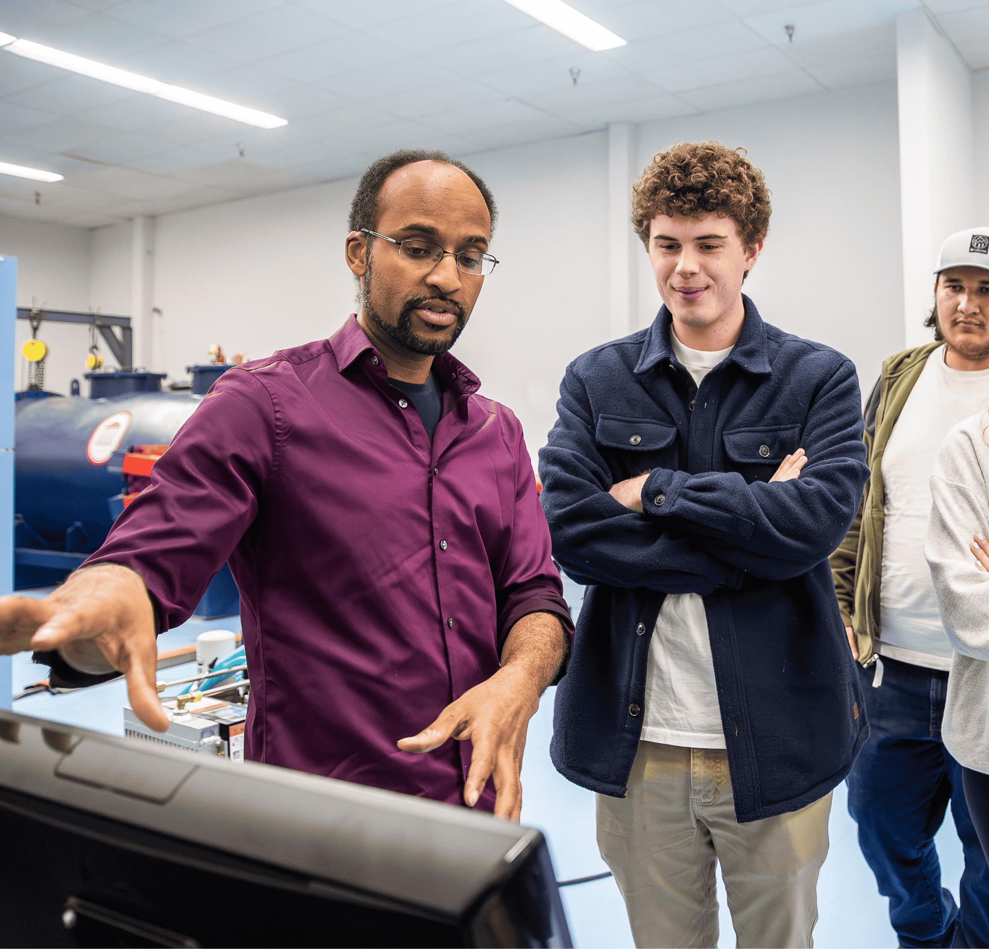Professor working in lab with students