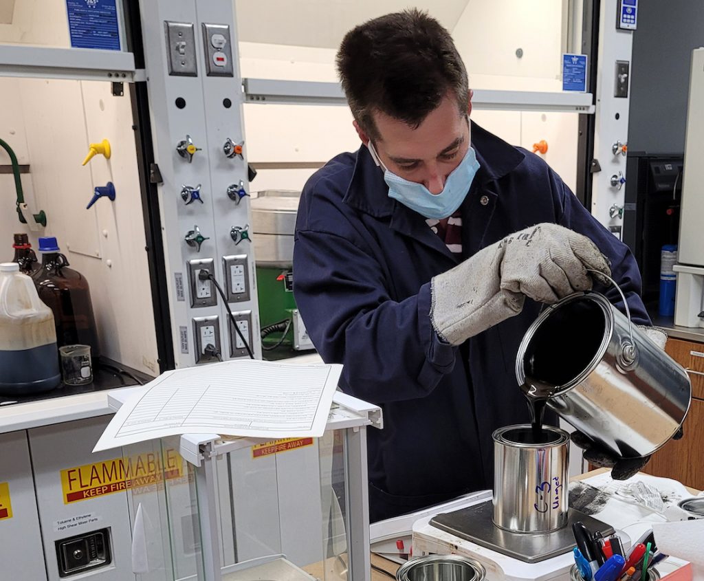 ERDC technician working on graphene-enhanced asphalt