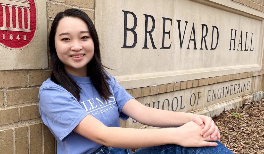 Abigail Moeller in front of Brevard Hall